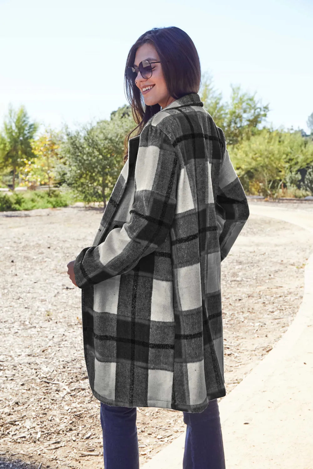 Black plaid coat back and side view in a sunny park setting