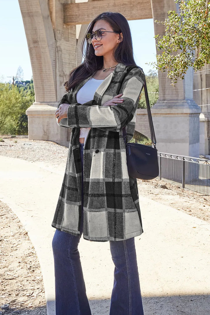 Black plaid coat full length front view with sunglasses and flare jeans