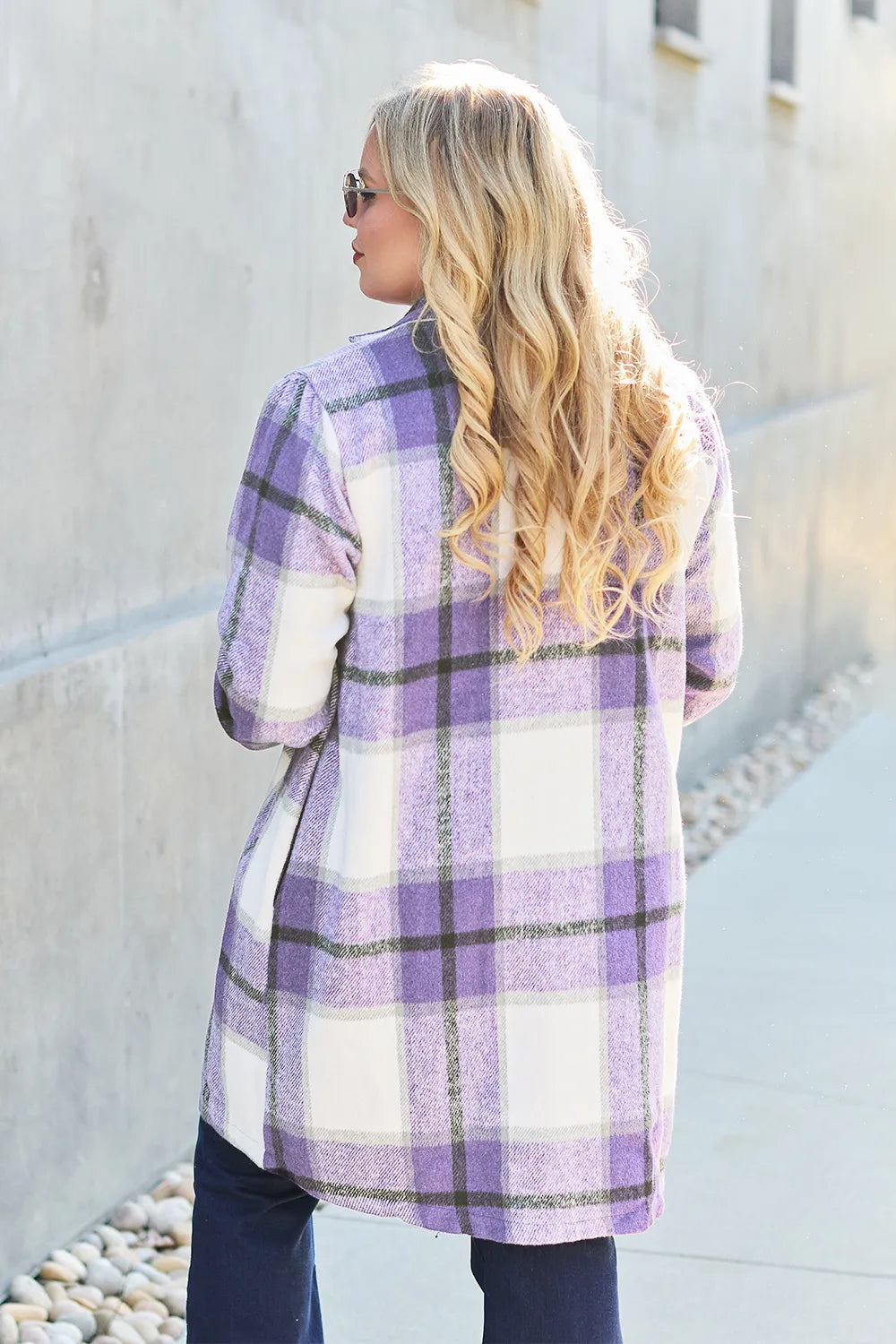 Back view of lavender plaid mid length coat with long blonde hair