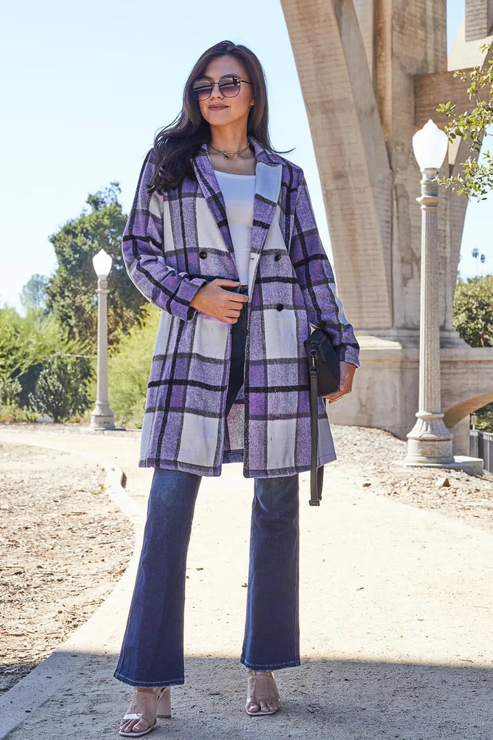 Lavender plaid coat mid length with notch lapel and flare jeans outdoors