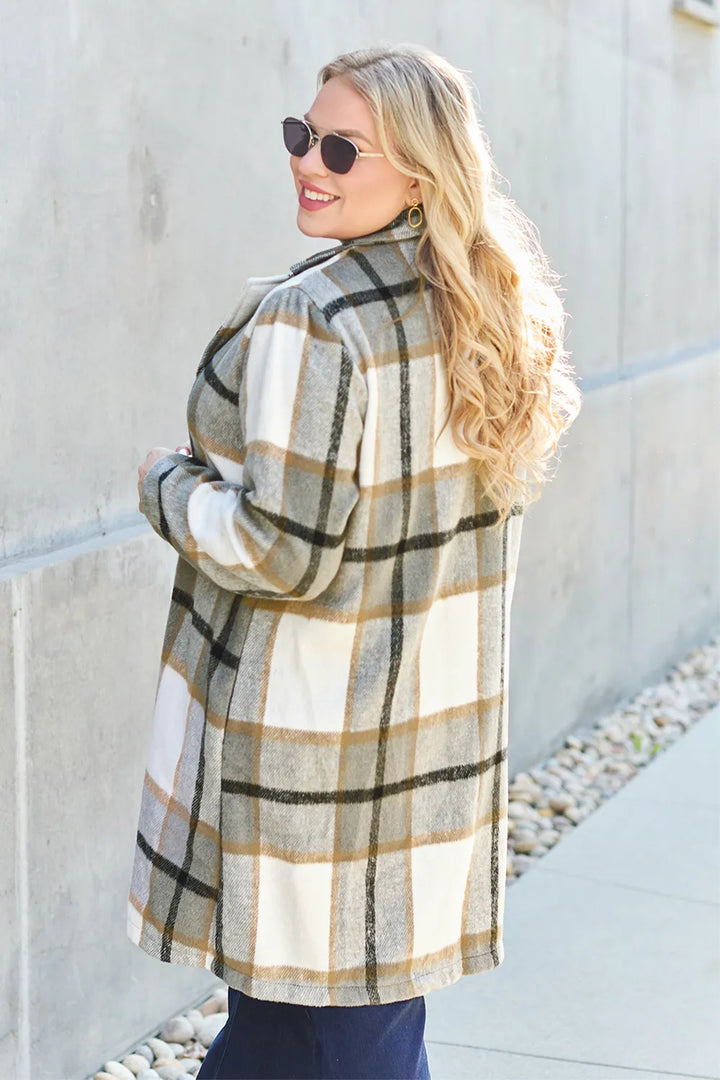 Olive plaid coat turned to the side showing back and sleeve
