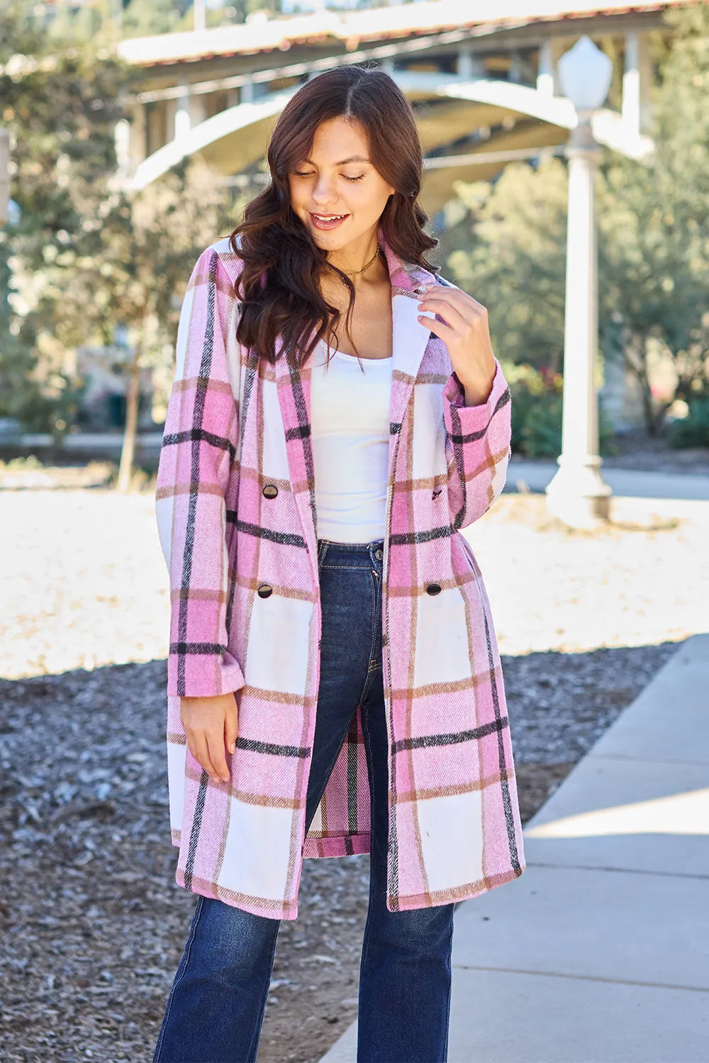 Women's coat in pink plaid, mid length with notch lapel collar, front view
