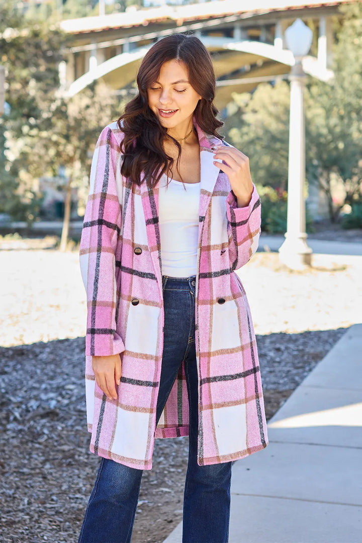 Women's coat in pink plaid, mid length with notch lapel collar, front view