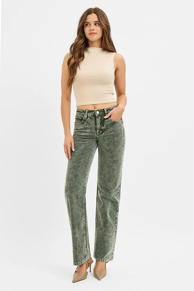 Olive green corduroy straight leg pants styled with a cream tank top and heels