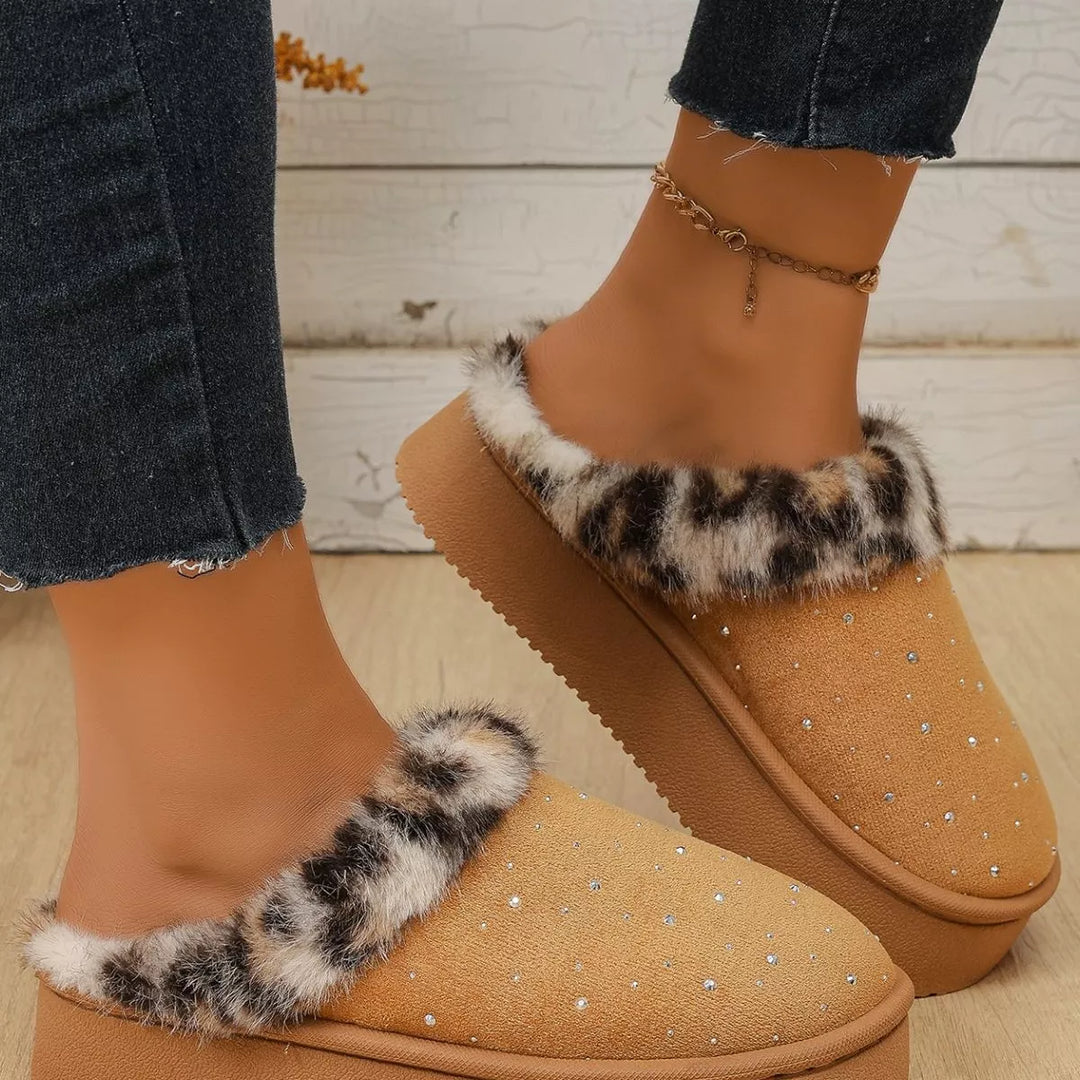 Camel platform slippers with leopard trim worn with jeans, angled view