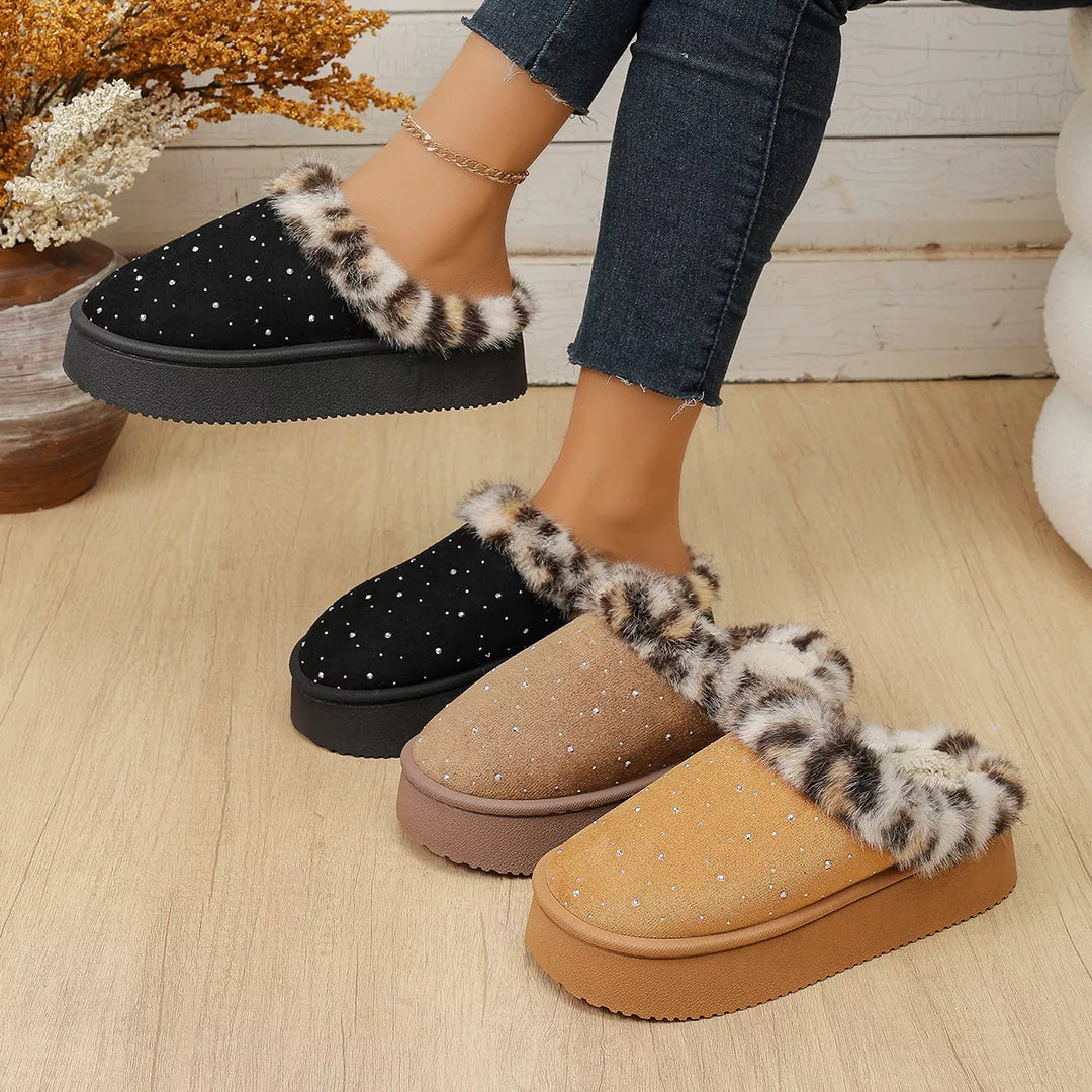 Women's cozy slippers in black, camel and taupe lined up with leopard trim and platform soles