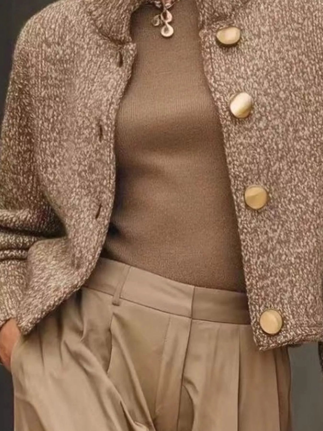 Camel button front cardigan styled with a knit top and pleated pants
