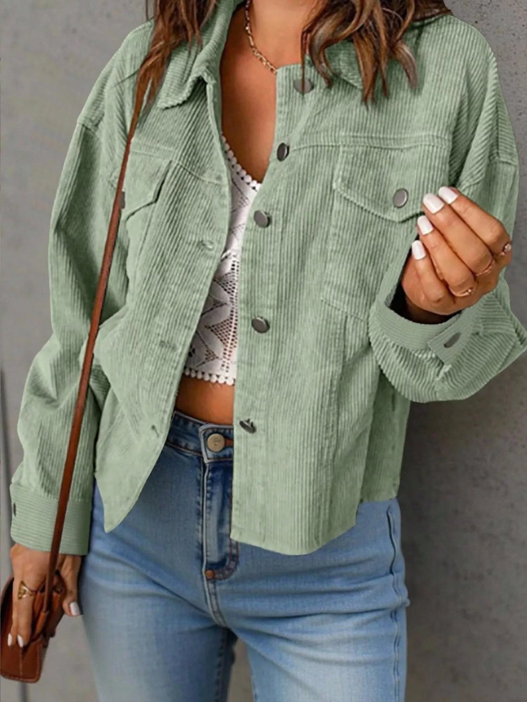 Sage green cropped jacket with button front and chest pockets