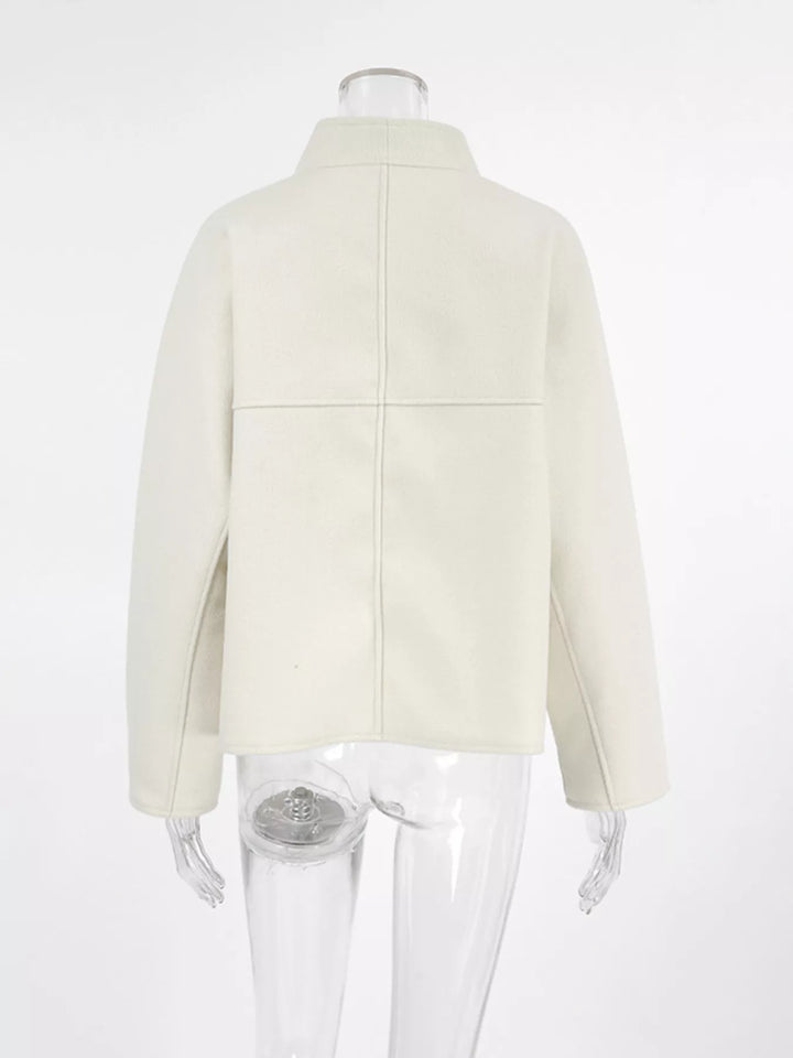 Ivory cropped jacket on a mannequin, back view