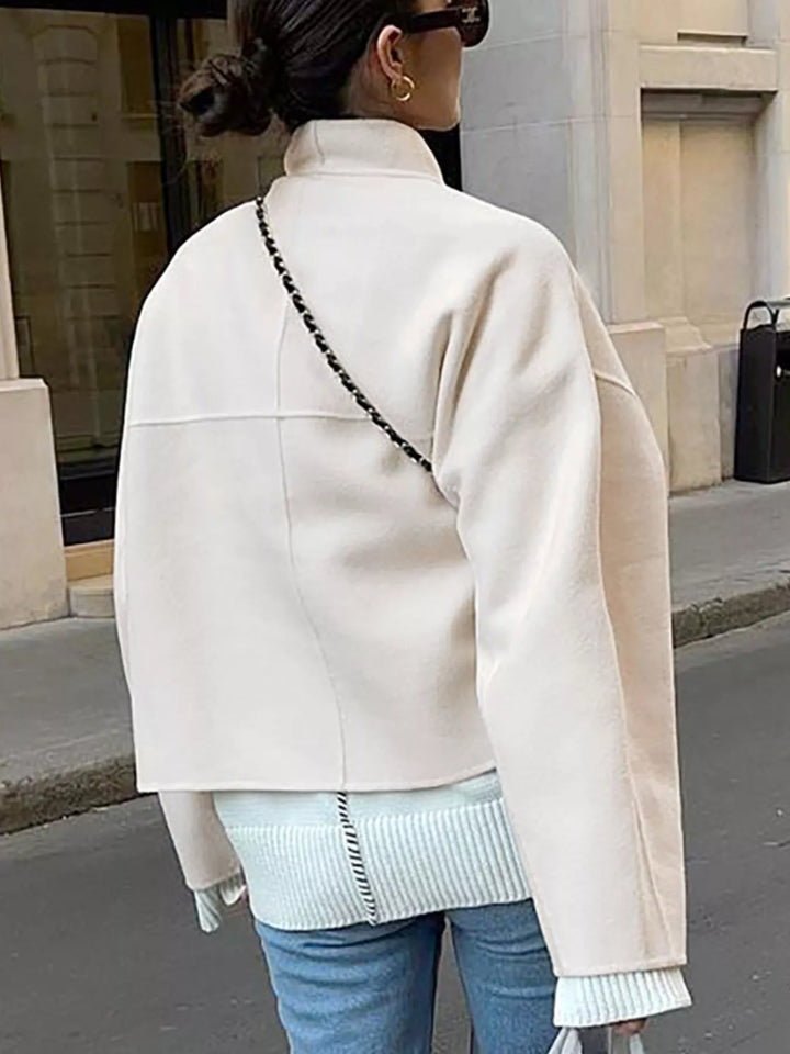 Back view of ivory cropped jacket with dropped shoulders