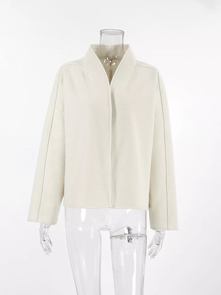 Ivory cropped jacket on a mannequin, front view