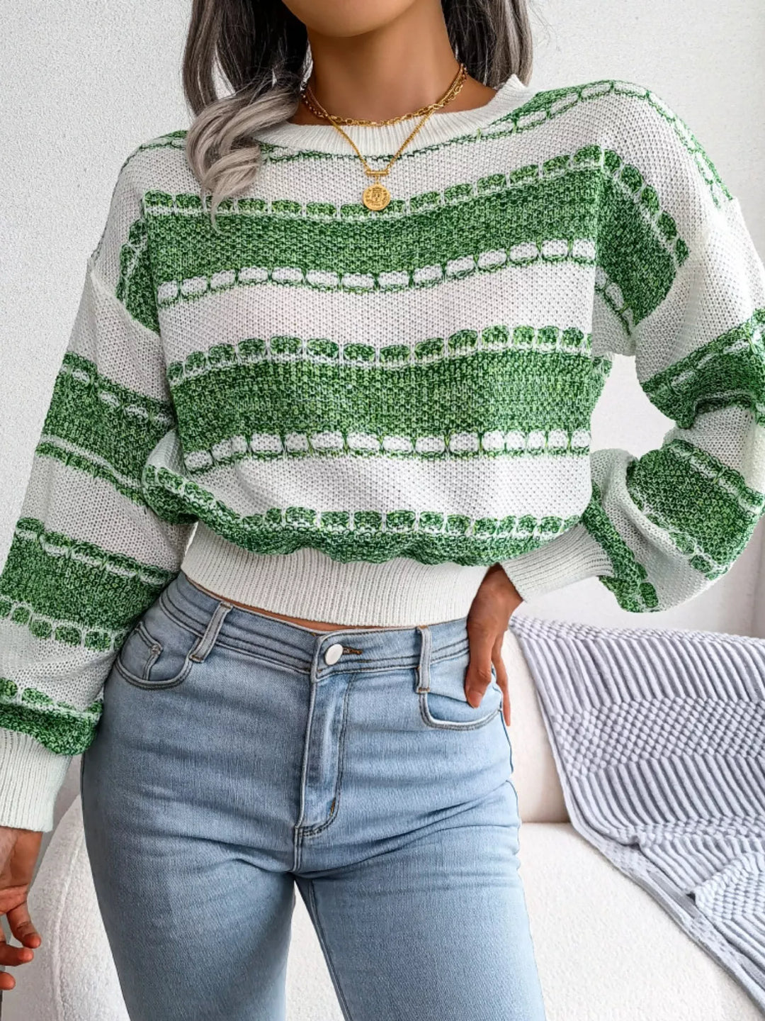 Front view of the green striped cropped sweater with long sleeves