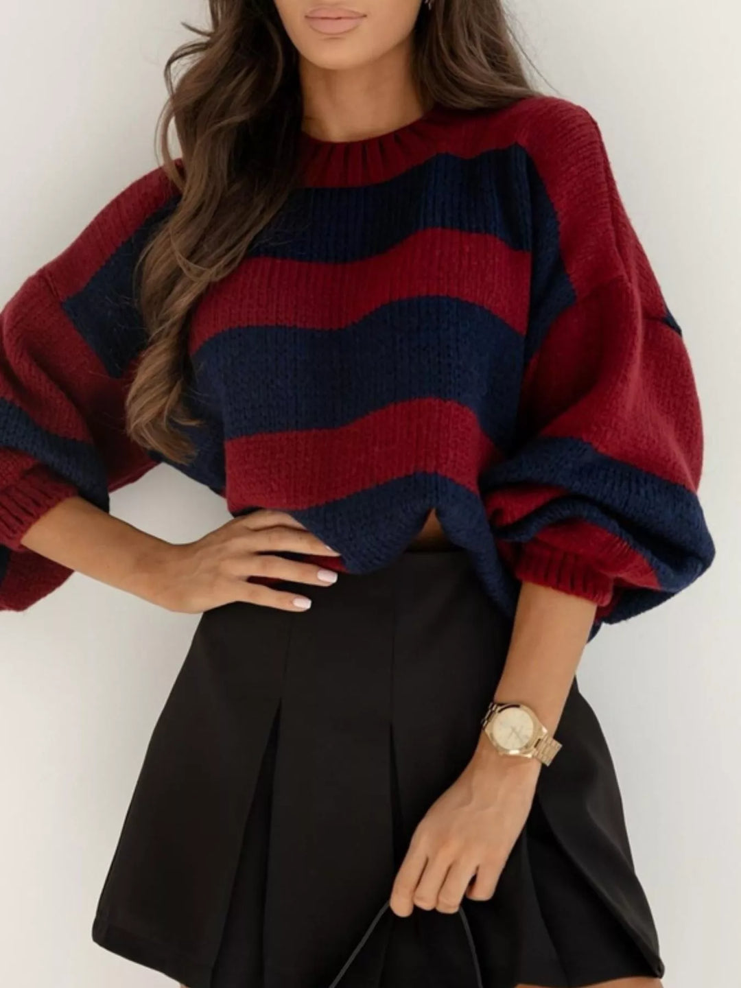 Burgundy and navy wide stripe cropped sweater with a black pleated skirt
