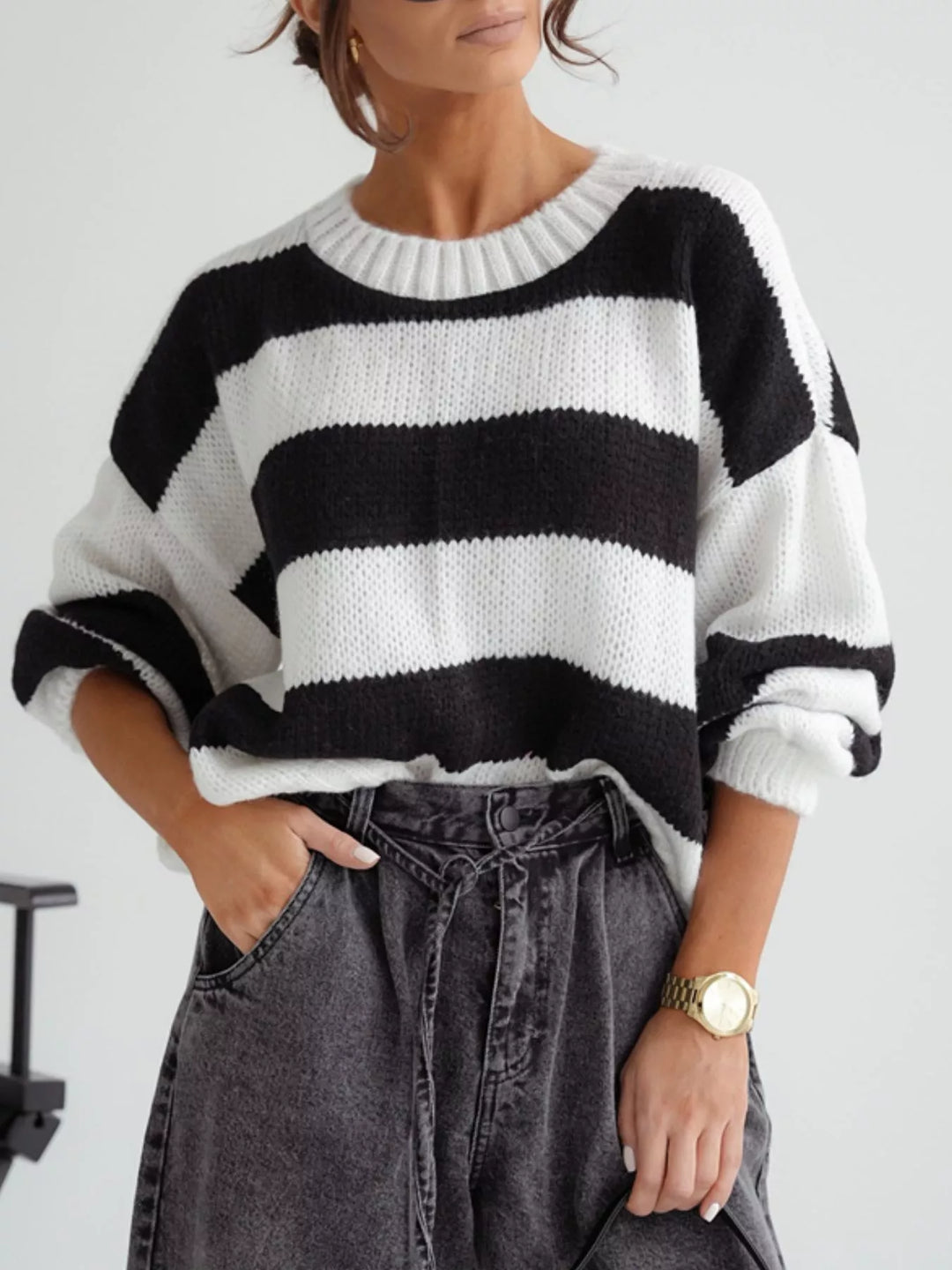 Navy white striped cropped sweater with a gray skirt and gold watch