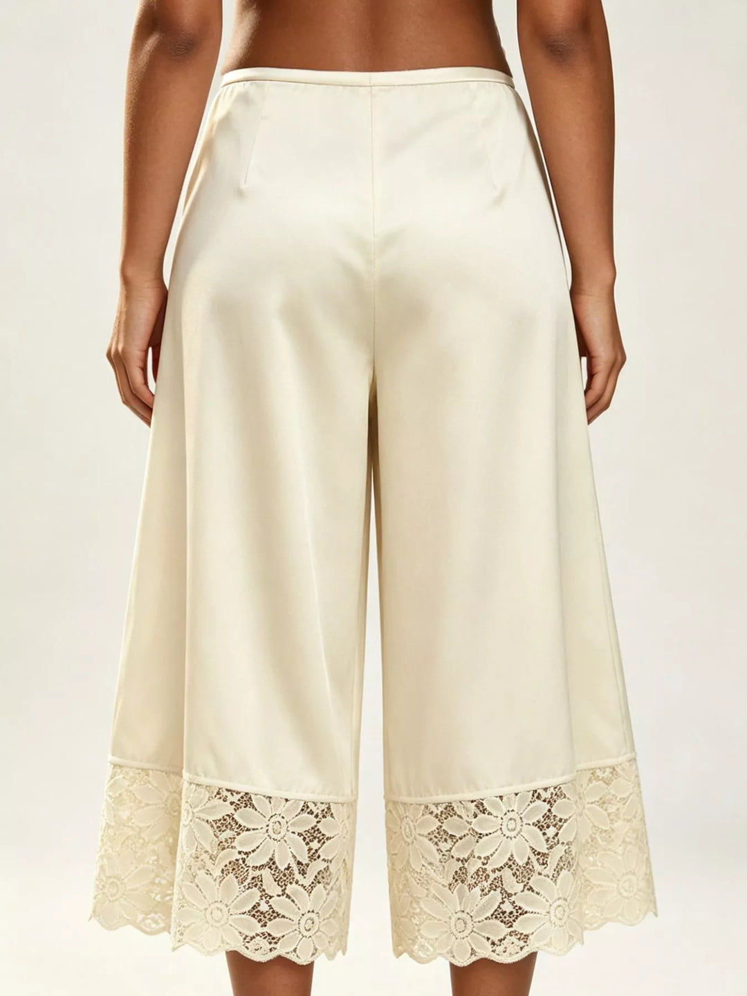 Back view of the champagne cropped wide leg pants with lace hem