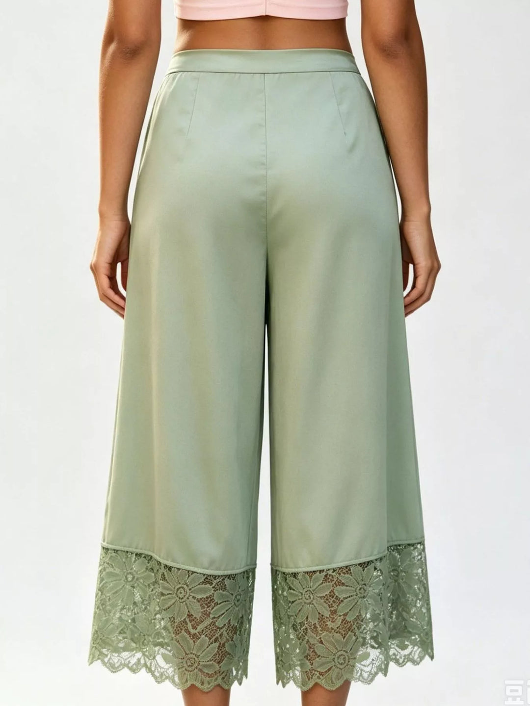 Back view of the sage green cropped wide leg pants with lace hem
