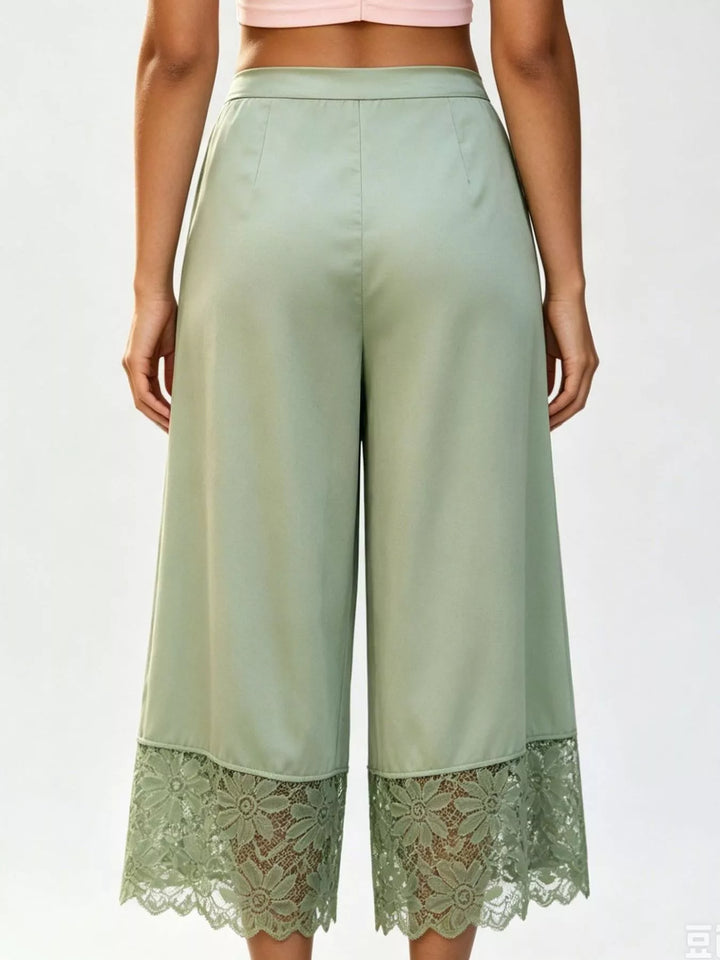Back view of the sage green cropped wide leg pants with lace hem