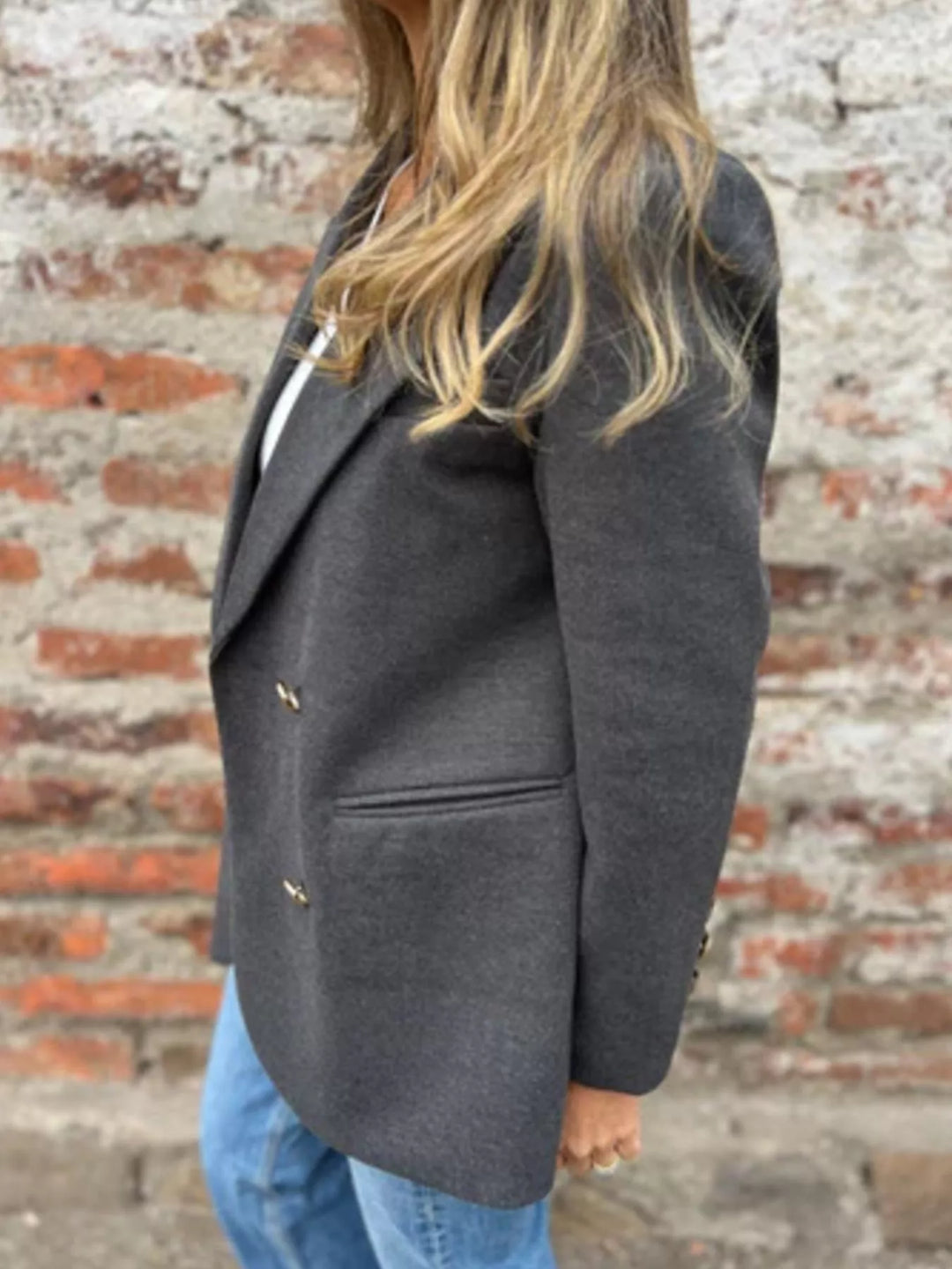 Charcoal oversized blazer side view with flap pocket and jeans