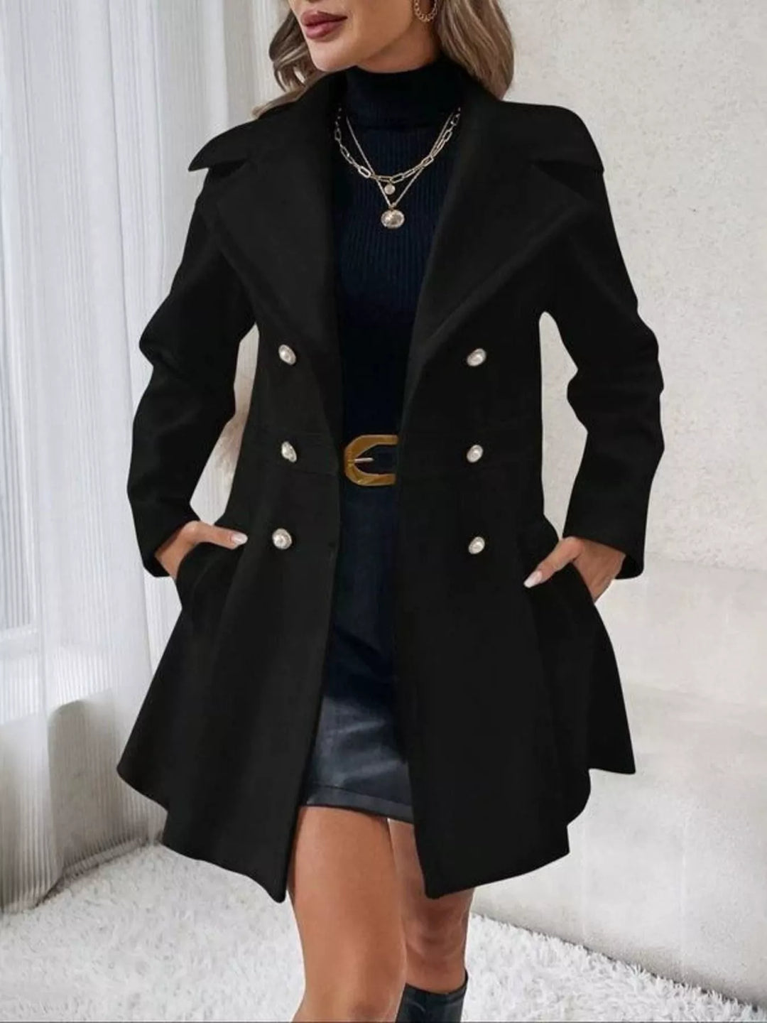 Black double breasted coat with fitted waist and flared peplum skirt