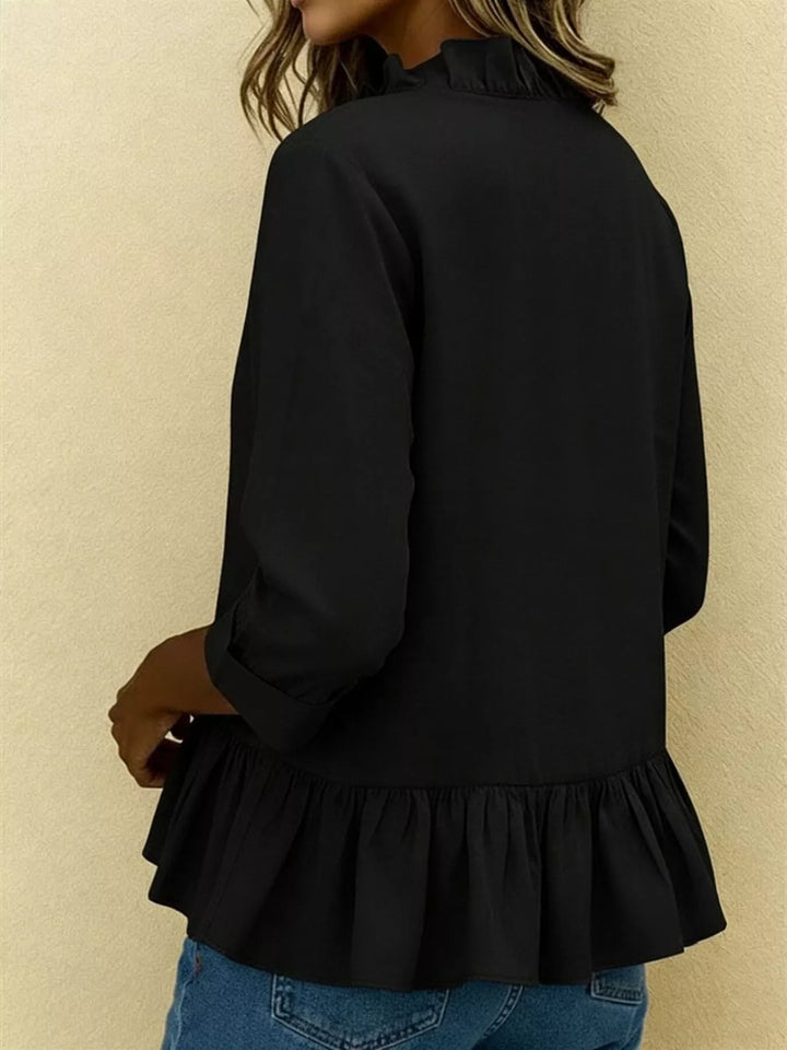 Ruffle front peplum hem relaxed v-neck in black, back view