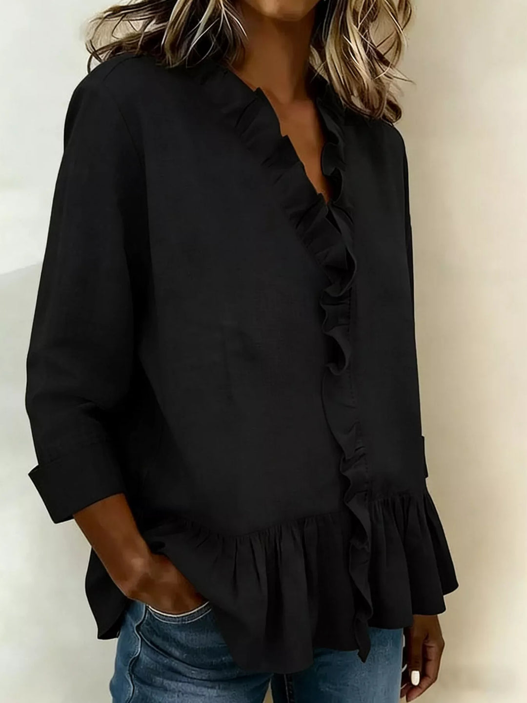Ruffle front peplum hem relaxed v-neck in black, styled on model