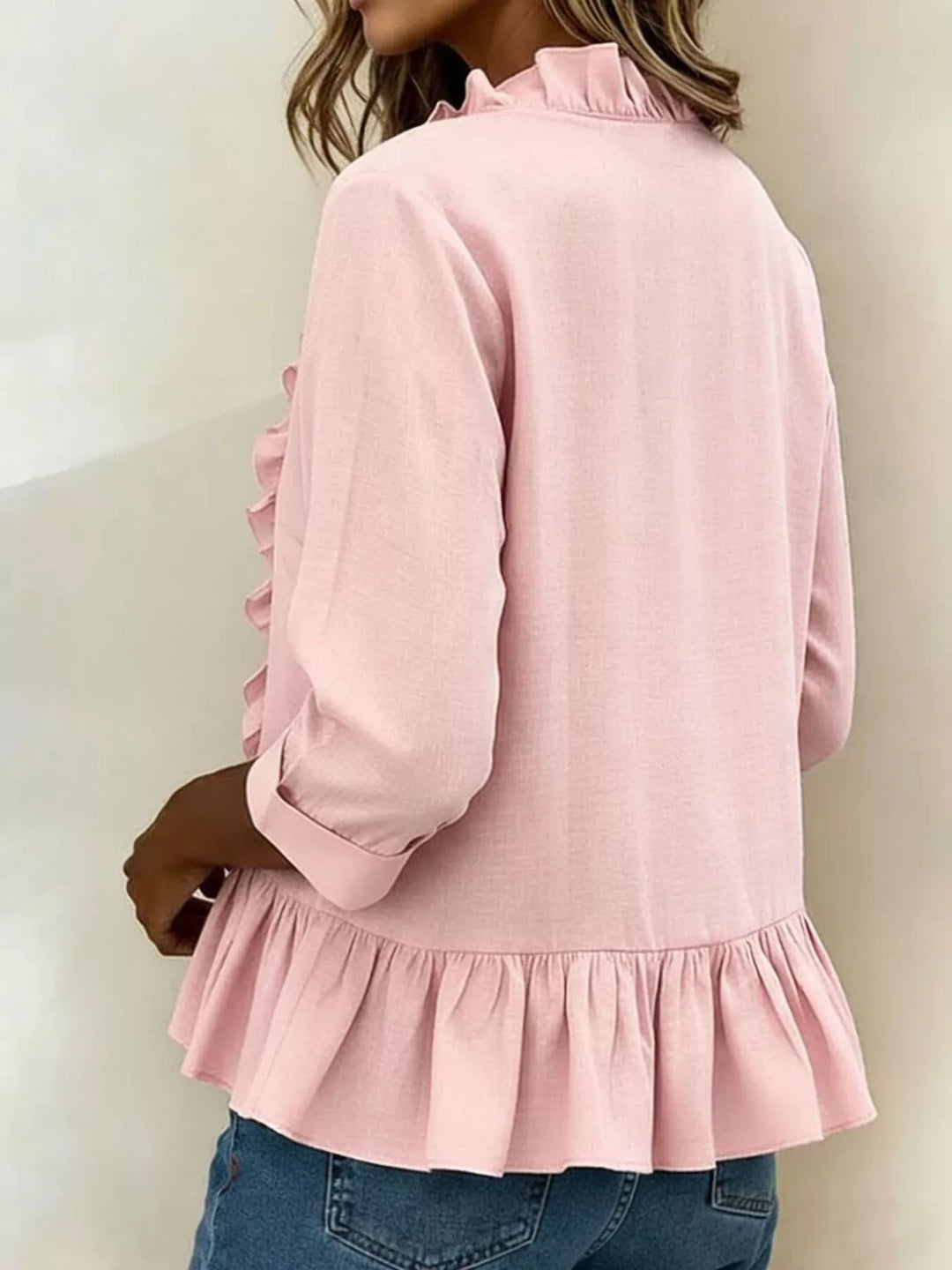 Ruffle front peplum hem relaxed v-neck in pink, back view