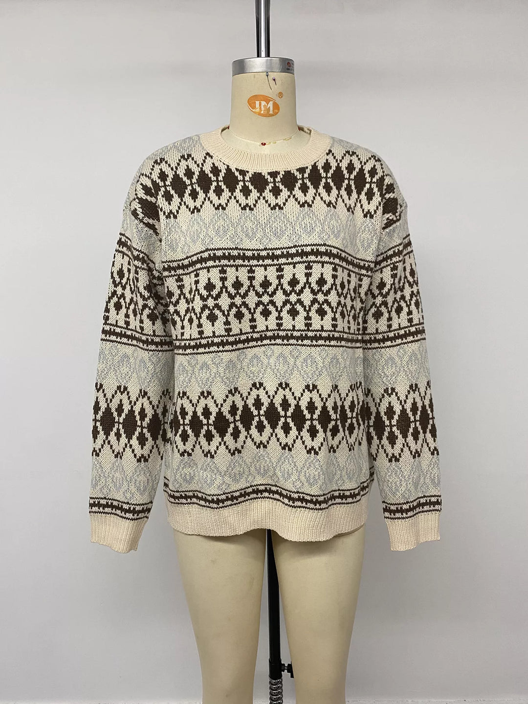 Crew neck ribbed trim relaxed fit in apricot color, front view 2