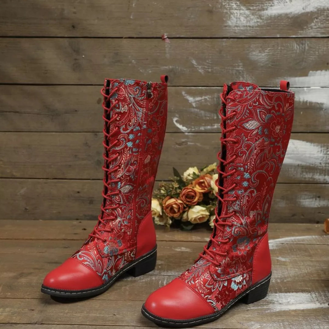 Pair of red embroidered floral boots with lace up fronts and a block heel
