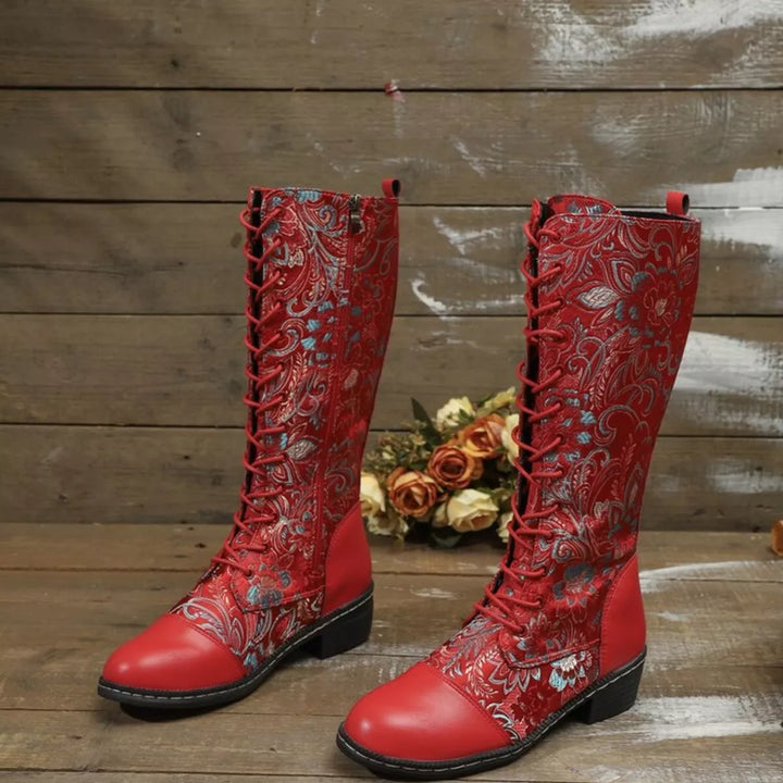 Pair of red embroidered floral boots with lace up fronts and a block heel