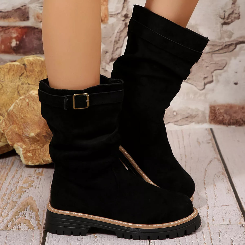 Pair of black mid calf slouch boots with buckle strap, front view