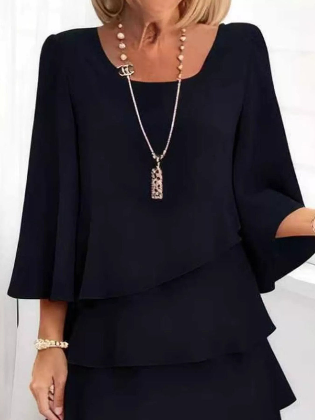 Tiered ruffle layered bell sleeve plus size in black, styled on model