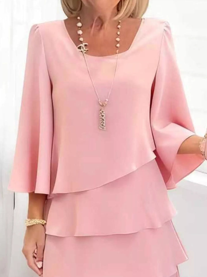 Tiered ruffle layered bell sleeve plus size in blush pink, styled on model