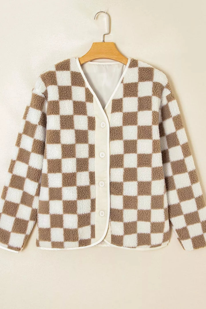 Brown checkerboard plush jacket hanging on a hanger, front view