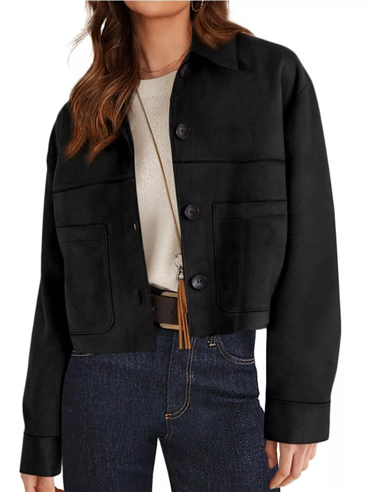 Black fall jacket with chest pockets, angled three quarter view