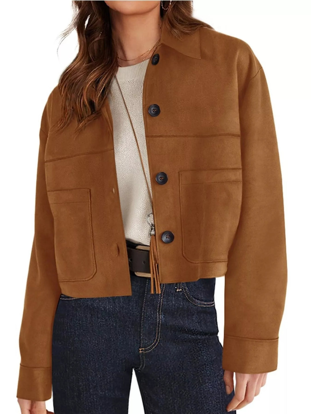 Caramel fall jacket with large chest pockets, worn with dark jeans