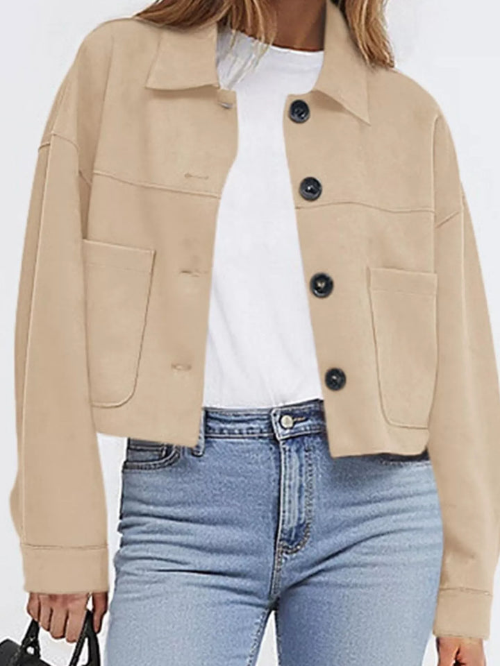 Sand cropped jacket with pockets, close-up of the front buttons