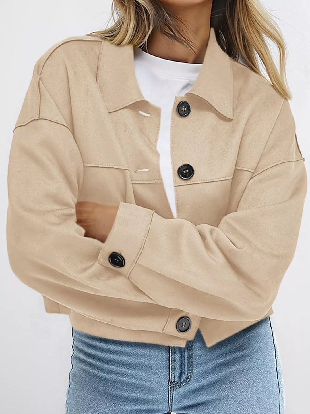 Sand cropped fall jacket with button front, arms crossed