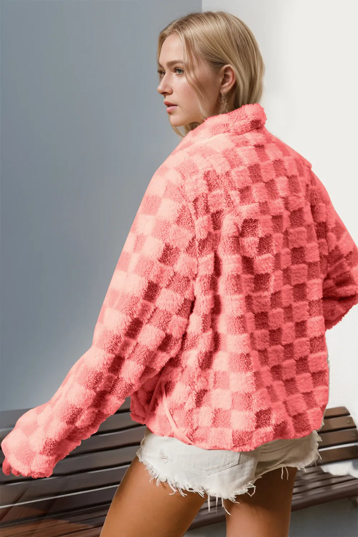 Back view of the coral pink fuzzy jacket with checkered pattern