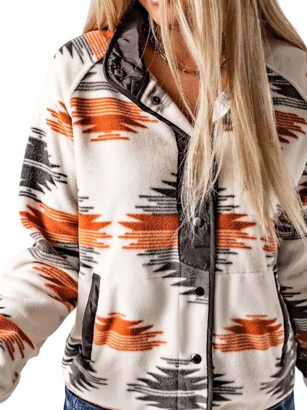 Close-up of the gray Aztec print half snap collar and pocket