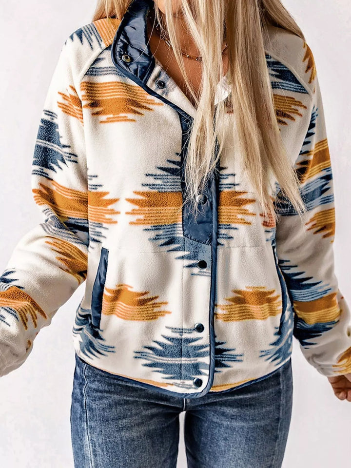 Navy Aztec print half snap pullover jacket with front pocket, standing