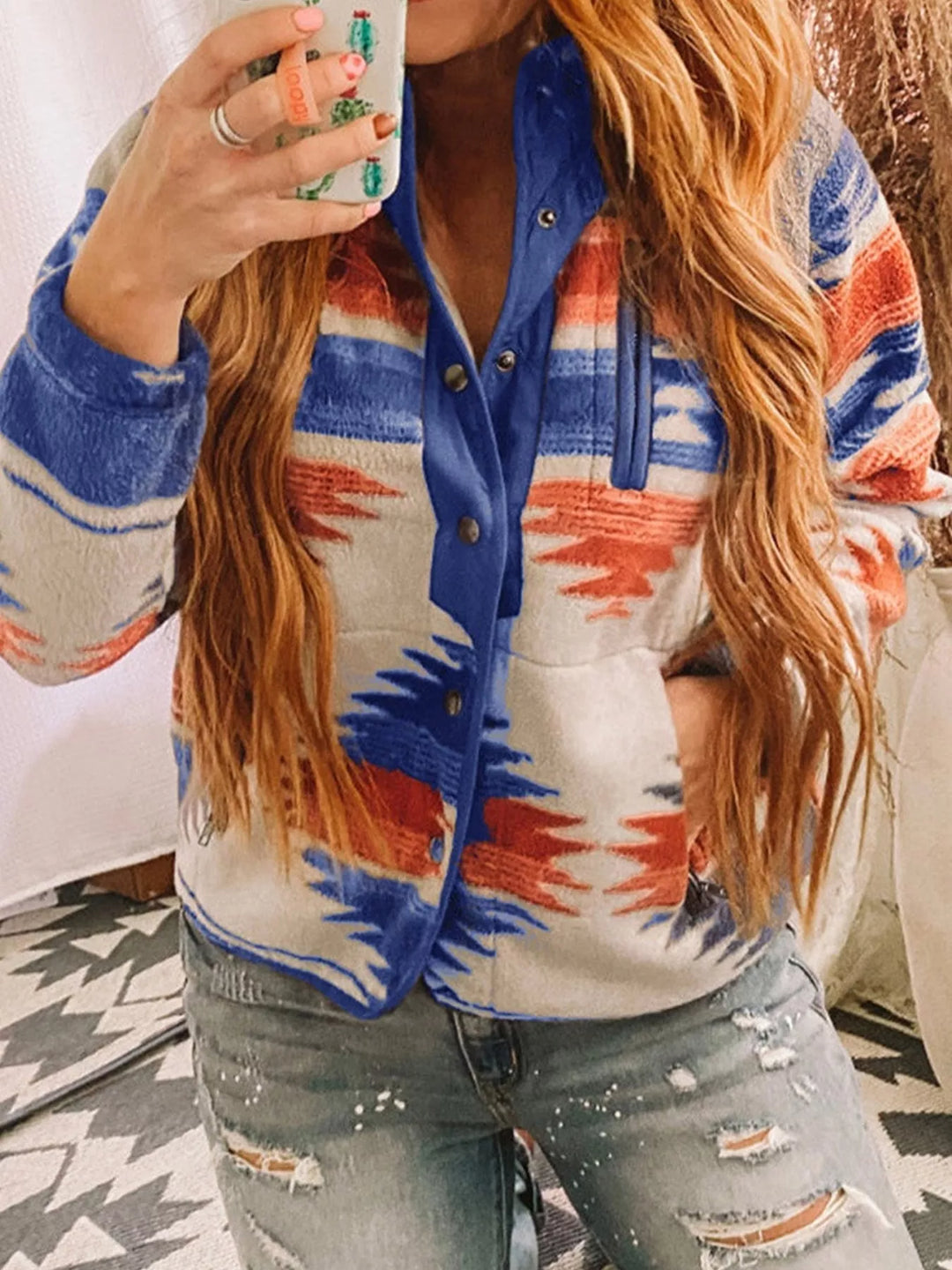 Royal blue half snap pullover jacket with distressed jeans, front view