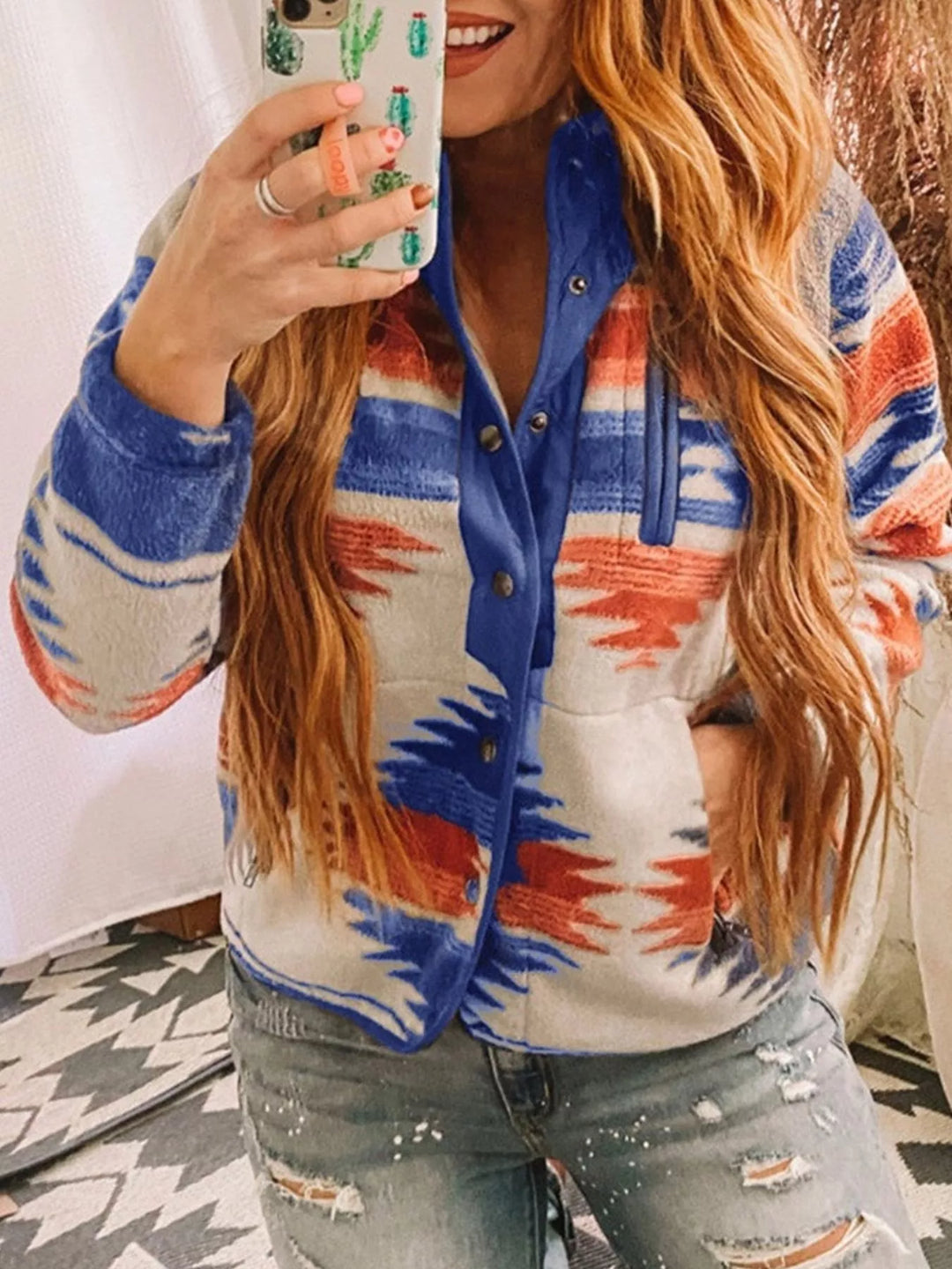 Royal blue Aztec print half snap jacket in a mirror selfie pose