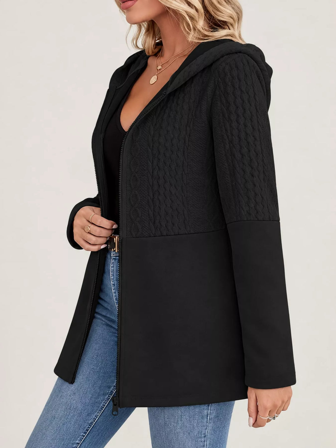 Hooded zip front cable knit colorblock in black, styled on model