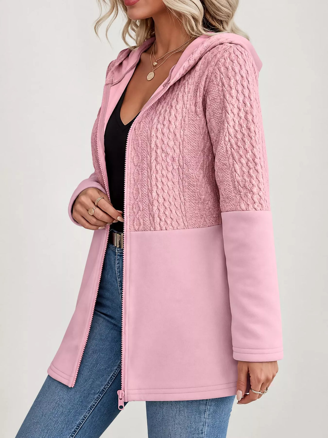 Hooded zip front cable knit colorblock in pink, styled on model