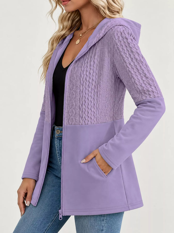 Hooded zip front cable knit colorblock in purple, styled on model 2