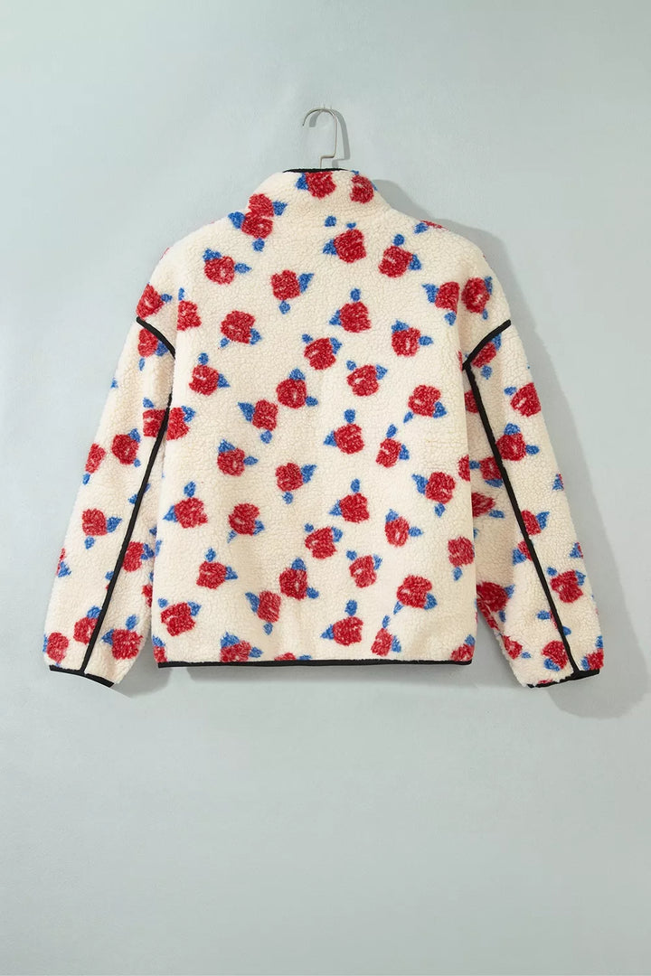 Back view of the cream floral rose print jacket on a hanger