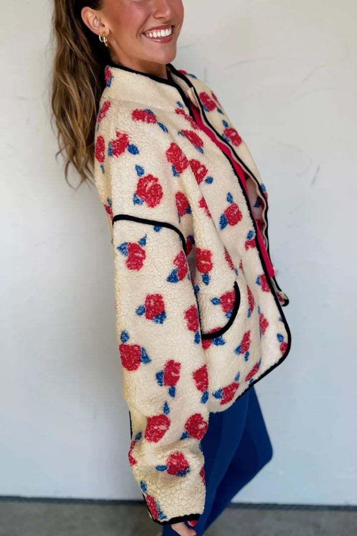 Cream floral plush jacket in angled side view with hair swept back