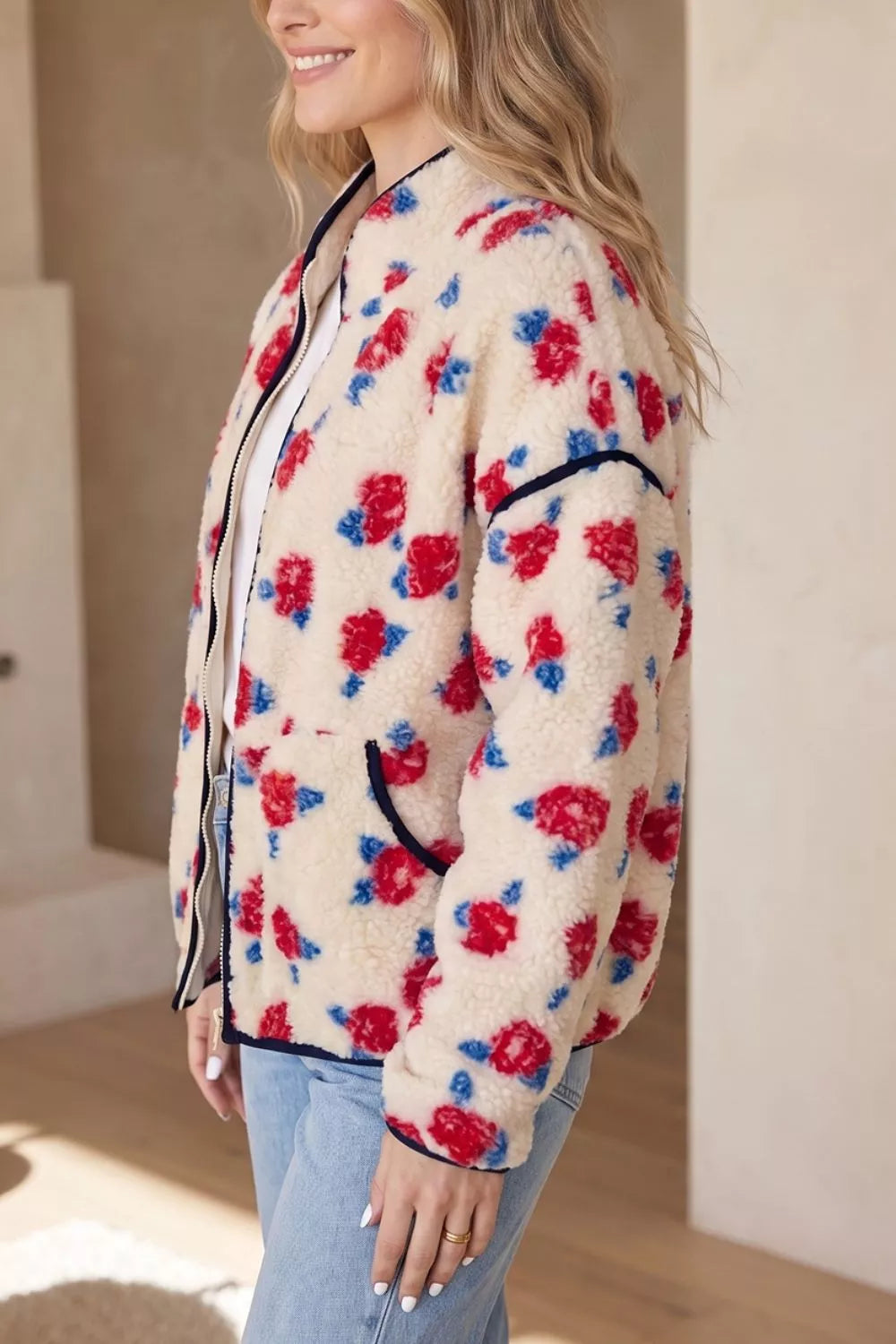 Cream floral rose print plush jacket, side view with black piping
