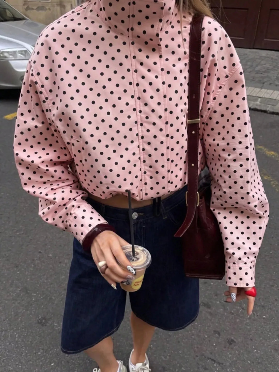 Polka dot zip front stand collar cropped in pink, front view