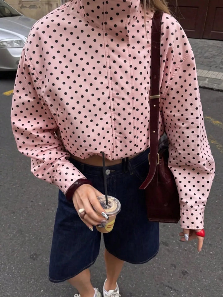 Polka dot zip front stand collar cropped in pink, front view